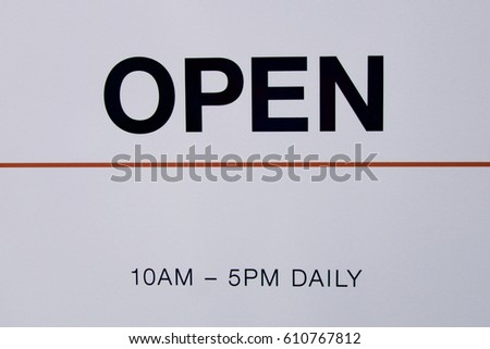 Open and hours sign.