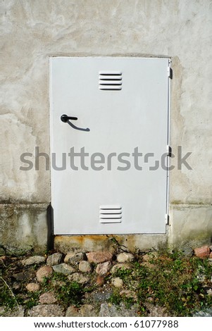 White door against plastered wall. Gotland, Sweden.