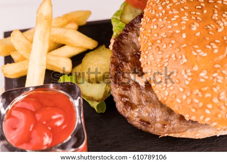 Hamburger With French Fries And Ketchup