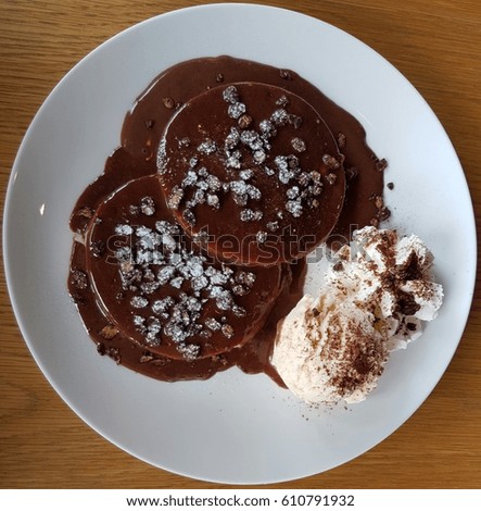 Pancake with chocolate syrup and ice cream