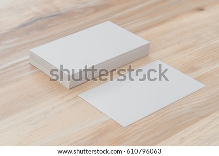 Business cards on wood table.