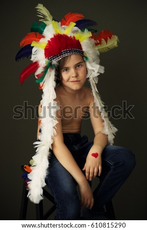 Boy wearing an indian style costume headdress