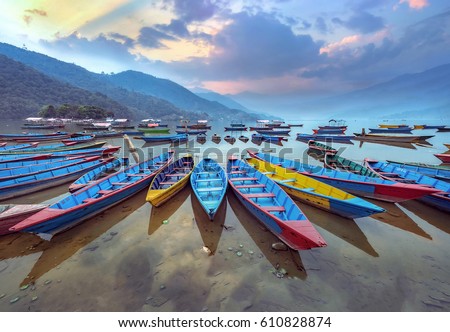 Color boat symbol of Phewa lake shore in Pokhara, Nepal. Royalty-Free Stock Photo #610828874
