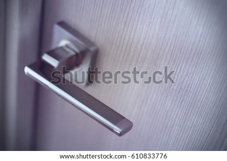 Door handle close-up with blurred background
