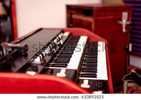 A vintage double manual organ with draw bars and rotating speaker