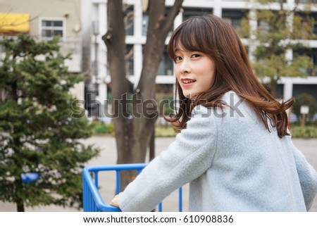 Young woman playing in the park