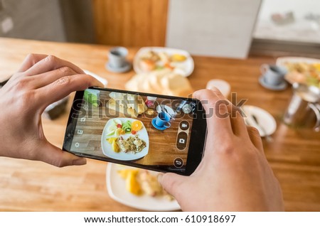 taking photo at breakfast on table