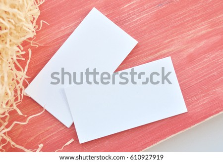 Business card on red wood