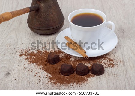 Dessert cocoa truffle, cinnamon and a cup of coffee