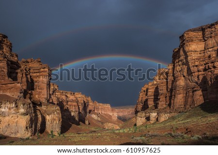 Double rainbow over the Charyn canyon Royalty-Free Stock Photo #610957625