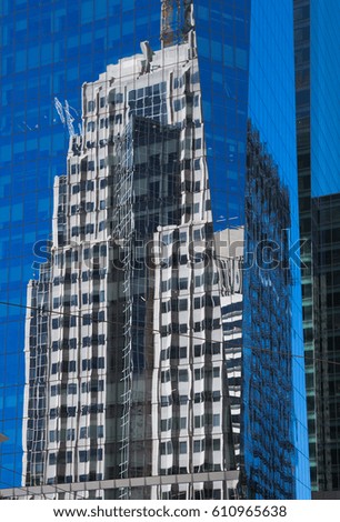 Skyscrapers of san francisco and reflections in windows against the blue sky