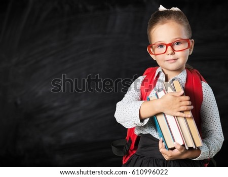 Child with book. Royalty-Free Stock Photo #610996022