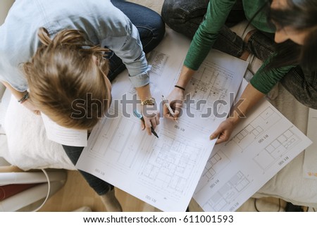 Two Girls Studying In The Bedroom