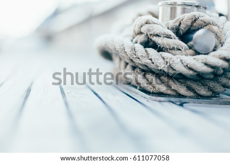 rope on a yacht with wooden details Royalty-Free Stock Photo #611077058