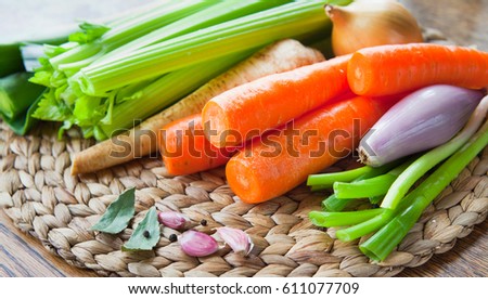 Fresh ingredients for veggie stock : carrots, celery, leeks, onion, carrots, parsnip, parsley, garlic, bay leaves, peppercorns, chili. Seasonal vegetables to make your soup. The best from farm shop.