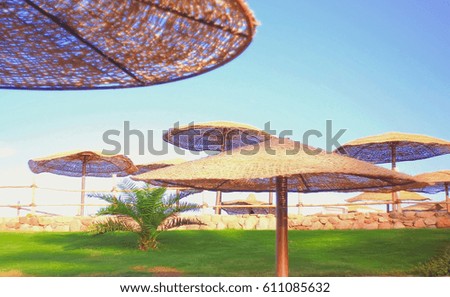 exotic beach with umbrellas, beach vacation on the ocean, luxury hotels ,Selective soft focus