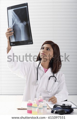 Doctor reading x ray
