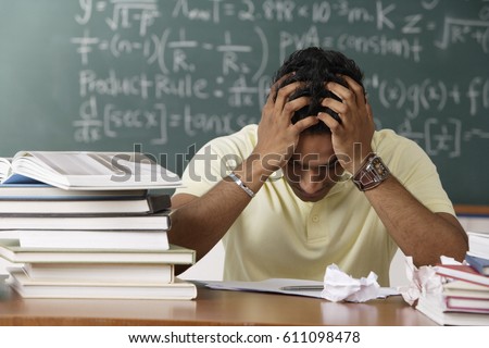 young man feeling stressed Royalty-Free Stock Photo #611098478