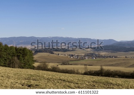 Meadow with trees and views to mountains. Slovakia