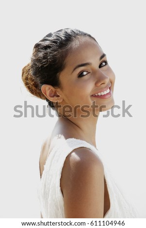 head shot of young woman smiling at camera