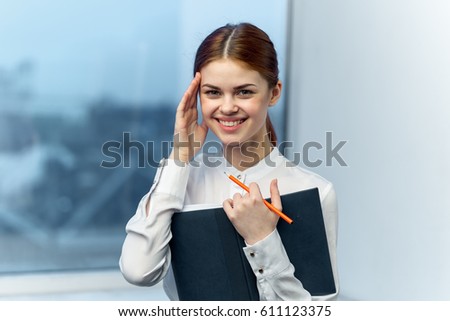 Pretty business woman smiling embarrassedly smiling