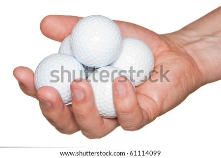 Golf balls in hand isolated on white.