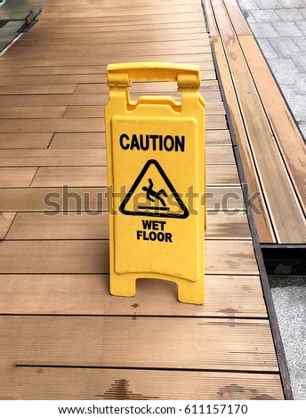 Caution wet floor warning yellow signage