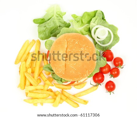 Fresh hamburger with french fries, salad and tomatoes isolated over white background