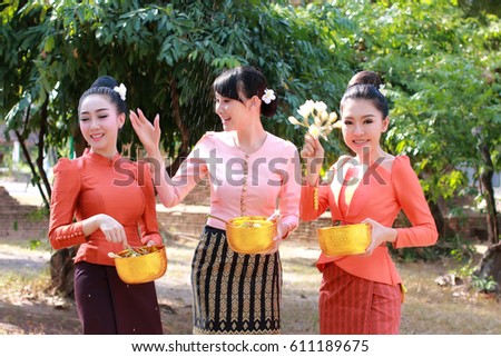 Welcome Songkran Festival in Thailand,Beautiful women wearing Thai national dress.