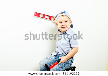 a little boy with a hammer and measuring tape, isolated of white background