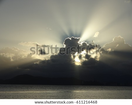 Divine sunlight behind the clouds, in the brazilian city of Santos, state of São Paulo