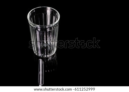Faceted beer glass on a black background. Silhouette of a white beer mug lines on a black background.