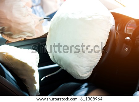 Air bag deployed after car wreck aftermath. Royalty-Free Stock Photo #611308964
