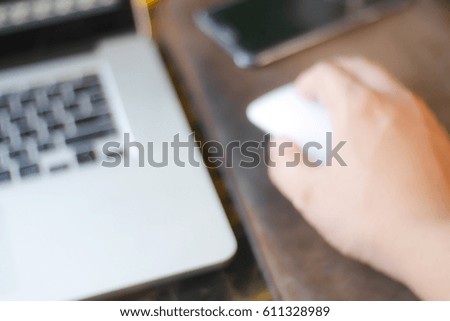 Picture blurred  for background abstract and can be illustration to article of hand people woking with laptop