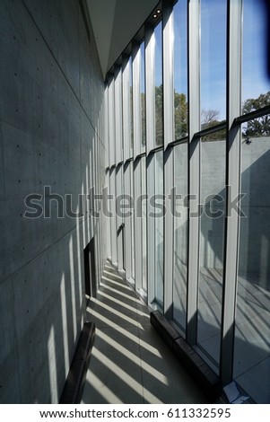 Simple interior design: Glass geometric windows with concrete wall, sunlight and shadow