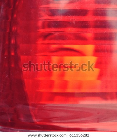 Colorful of the old car tail lamp,Abstract background with black and orange patterns on red surface, Texture for add text or graphic design 