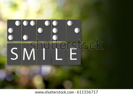 Black and White of Braille Alphabet meaning of SMILE on Color Bokeh Blur Background.