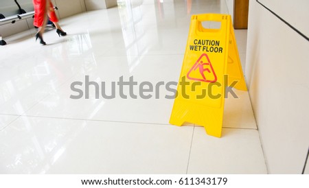Wet floor caution sign on floor 