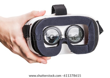 Hand holding virtual reality glasses isolated on white background