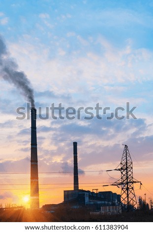 Thermoelectric station generating smokes at the sunset