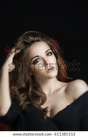 Portrait of young and beautiful girl on background