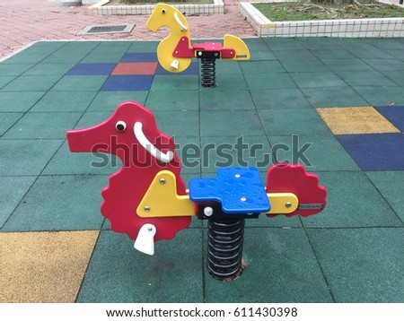 Spring animal playground equipment in a park																									