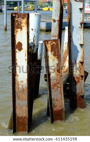 Metal posts left over from an old pier in Chao Phraya River Bangkok, Thailand.