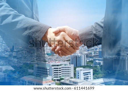 Business People Handshake Greeting Deal Concept, modern city background.