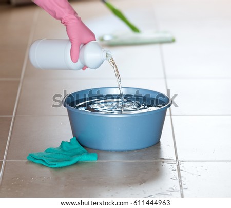 wet floor cleaning Royalty-Free Stock Photo #611444963