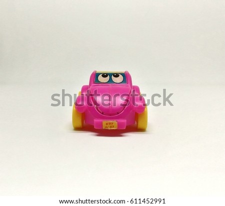 Cartoon pink toy car on a white background