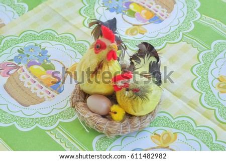 Easter composition. Chicken, rooster, chick and egg in a nest