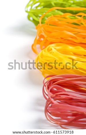 multicolored pasta on a white background. copy space