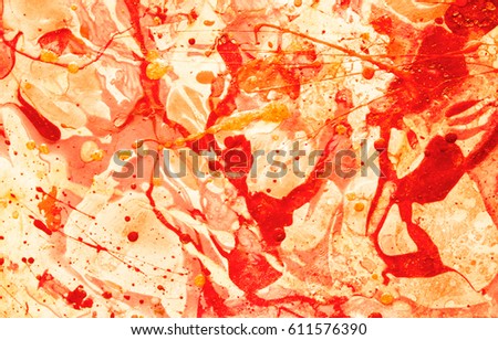Colourful handmade paper in yellow-red tones on white backdrop