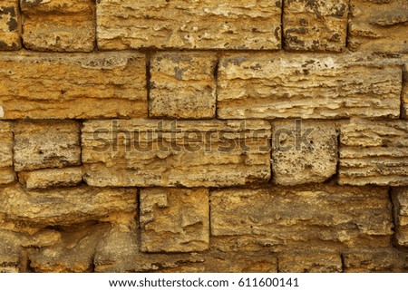Background for design. Stone wall. Natural stone background of old stone for design of project as background. Artistic background wall from natural shellfish, stone from an underground quarry